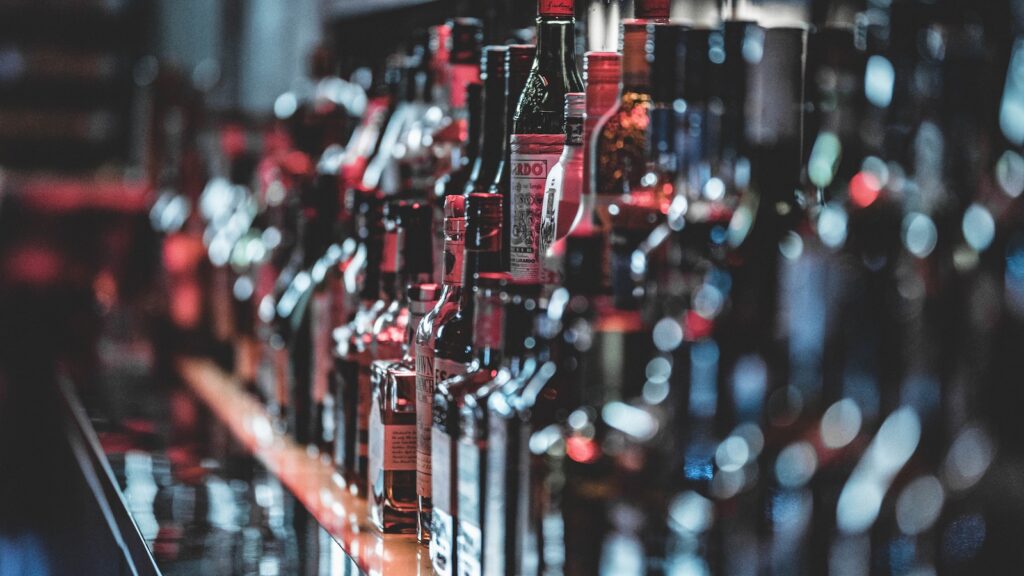 Selective Focus Photo Of Alcohol Bottles